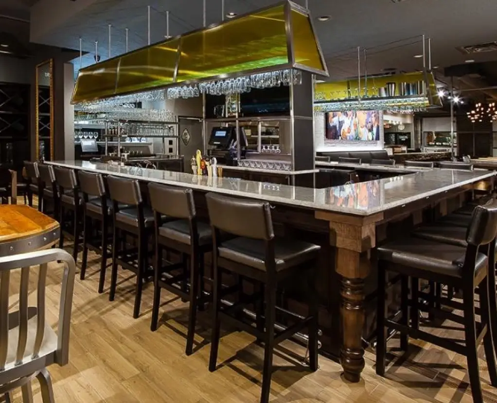 A premium indoor catering buffet display with elegantly arranged small plates and upscale food presentation setups for private events at J. Baldwin's.